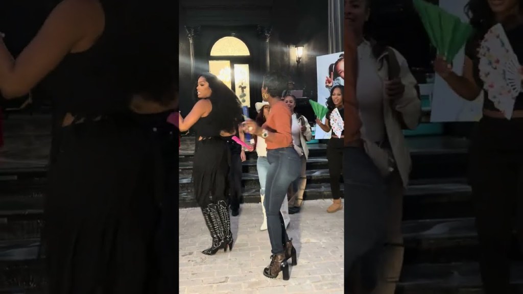 Shamea Morton teaching Tiny and Toya a country dance
